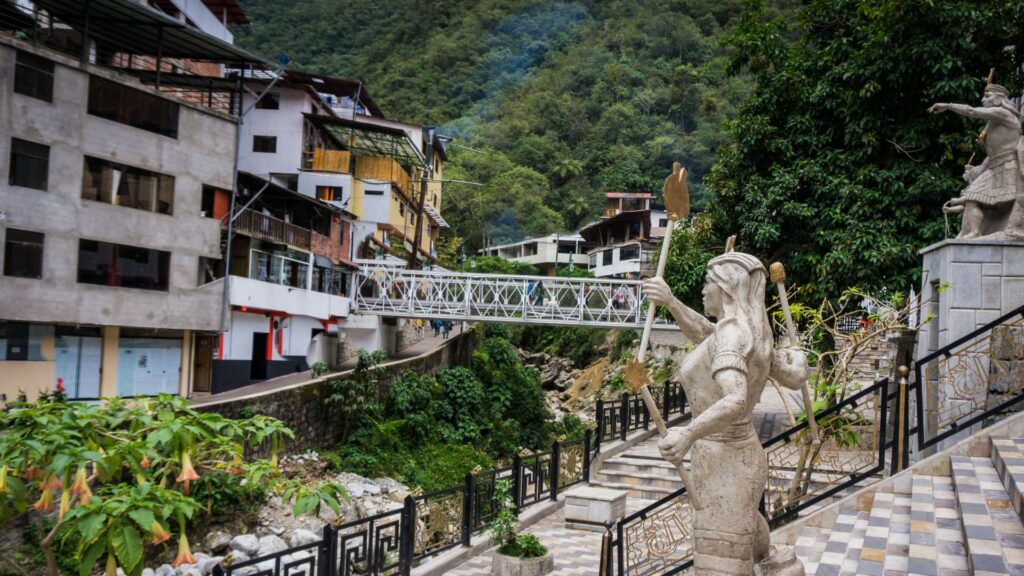 Statues of Inca figures in the town of Aguas Calientes, the gateway village to Machu Picchu nestled in a deep mountain valley – Qosqo Expeditions
