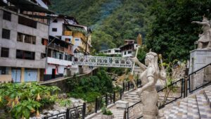 Statues of Inca figures in the town of Aguas Calientes, the gateway village to Machu Picchu nestled in a deep mountain valley – Qosqo Expeditions