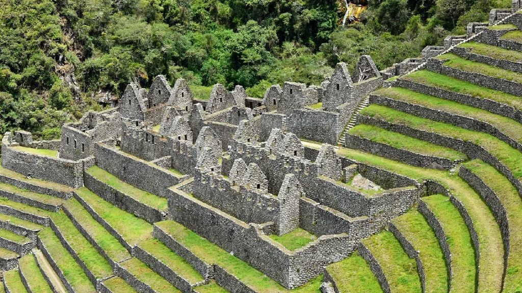 Panoramic view of the agricultural terraces and stone structures of Wiñay Wayna on the Inca Trail.
