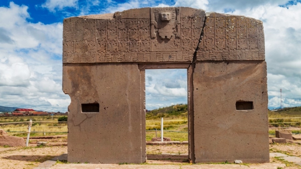 Central relief on the Gate of the Sun at Tiwanaku, depicting a figure holding a staff in each hand.